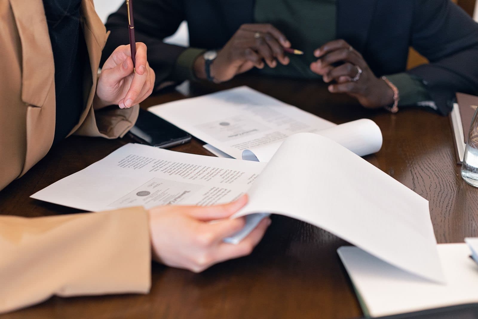 Two people reviewing property papers at a table